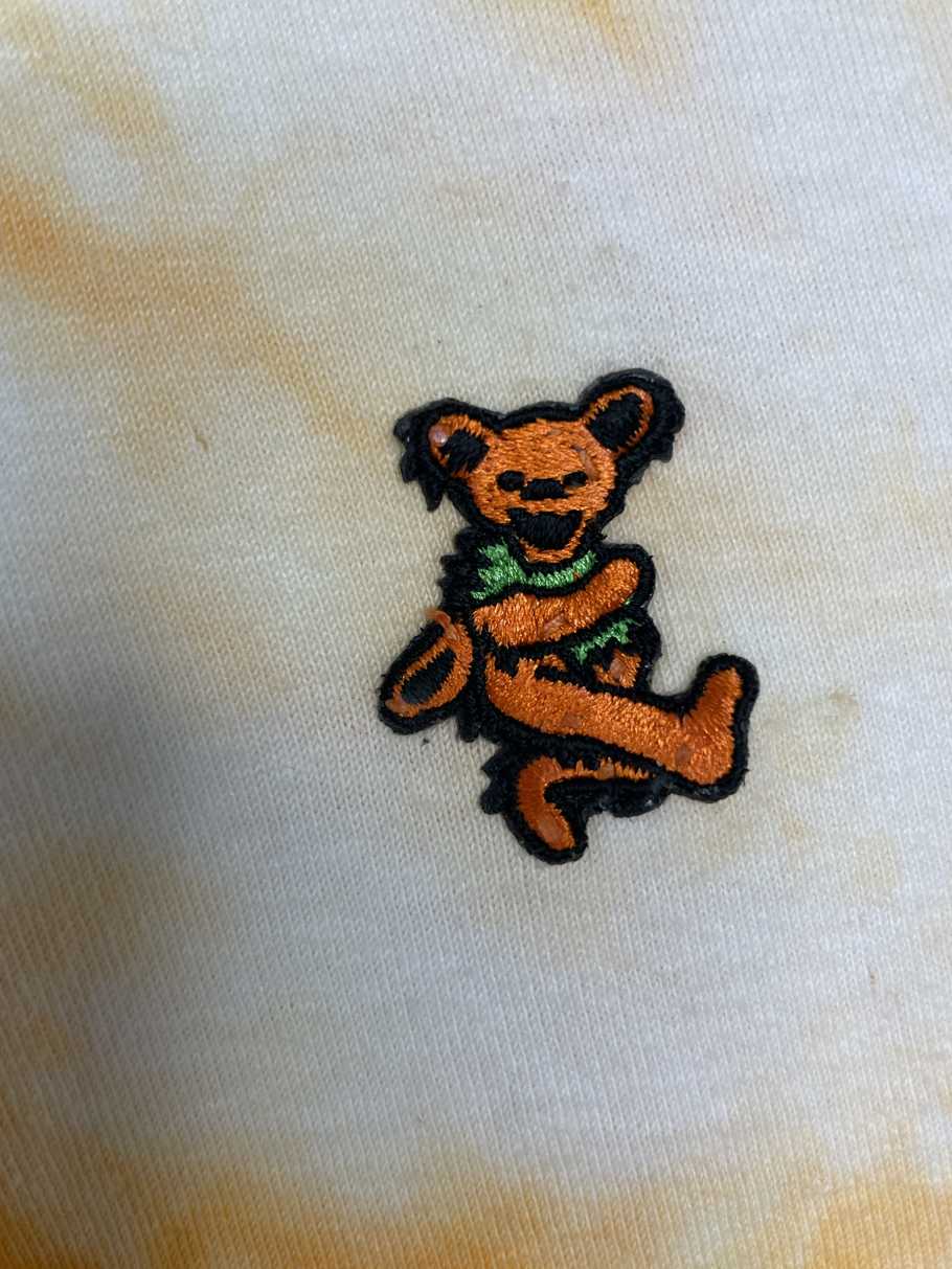 Orange dancing bear polo